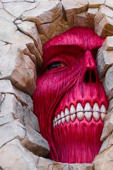 Osaka, Japan - Feb 6 2015 : Life size scale Statue of Wall giant from Attack on Titan (Shingeki no Kyojin) at Universal Studios Japan.