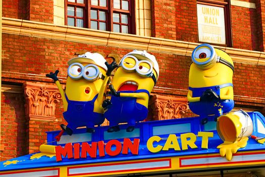 OSAKA, JAPAN - Nov 13, 2019 : Close up HAPPY MINION statue in Universal Studios Japan. Minions are famous character from Despicable Me animation.