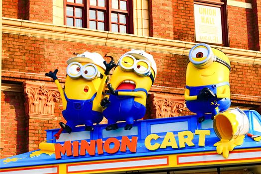 OSAKA, JAPAN - Nov 13, 2019 : Close up HAPPY MINION statue in Universal Studios Japan. Minions are famous character from Despicable Me animation.