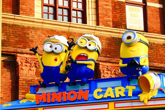 OSAKA, JAPAN - Nov 13, 2019 : Close up HAPPY MINION statue in Universal Studios Japan. Minions are famous character from Despicable Me animation.