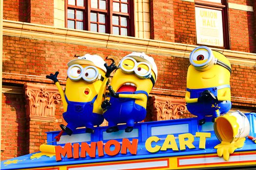 OSAKA, JAPAN - Nov 13, 2019 : Close up HAPPY MINION statue in Universal Studios Japan. Minions are famous character from Despicable Me animation.