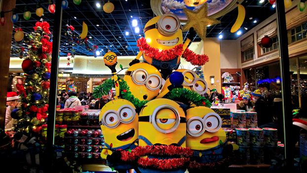 OSAKA, JAPAN - Nov 13, 2019 : Close up of Christmas Happy holiday version of HAPPY MINION statue in Universal Studios Japan. Minions are famous character from Despicable Me animation.