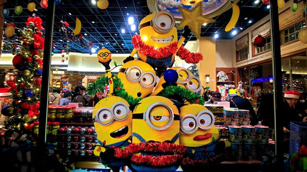 OSAKA, JAPAN - Nov 13, 2019 : Close up of Christmas Happy holiday version of HAPPY MINION statue in Universal Studios Japan. Minions are famous character from Despicable Me animation.