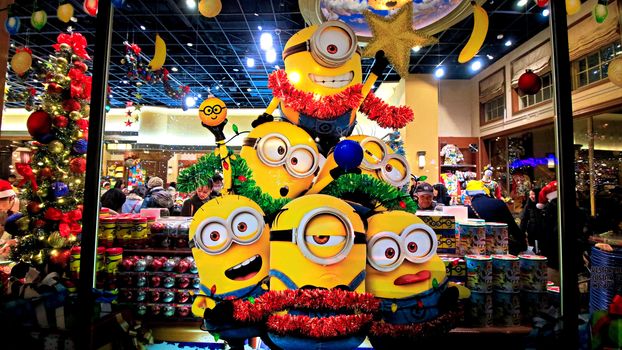 OSAKA, JAPAN - Nov 13, 2019 : Close up of Christmas Happy holiday version of HAPPY MINION statue in Universal Studios Japan. Minions are famous character from Despicable Me animation.