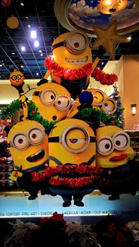 OSAKA, JAPAN - Nov 13, 2019 : Close up of Christmas Happy holiday version of HAPPY MINION statue in Universal Studios Japan. Minions are famous character from Despicable Me animation.