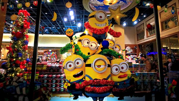 OSAKA, JAPAN - Nov 13, 2019 : Close up of Christmas Happy holiday version of HAPPY MINION statue in Universal Studios Japan. Minions are famous character from Despicable Me animation.
