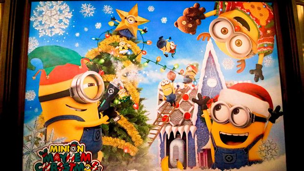 OSAKA, JAPAN - Nov 13, 2019 : Close up of Christmas Happy holiday version of HAPPY MINION statue in Universal Studios Japan. Minions are famous character from Despicable Me animation.