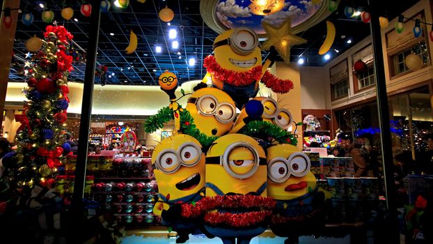 OSAKA, JAPAN - Nov 13, 2019 : Close up of Christmas Happy holiday version of HAPPY MINION statue in Universal Studios Japan. Minions are famous character from Despicable Me animation.