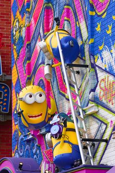 OSAKA, JAPAN - Feb 29, 2020 : Close up of HAPPY MINION statue, located in Universal Studios Japan. Minions are famous character from Despicable Me animation.