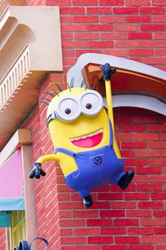 OSAKA, JAPAN - Feb 29, 2020 : Close up of HAPPY MINION statue, located in Universal Studios Japan. Minions are famous character from Despicable Me animation.