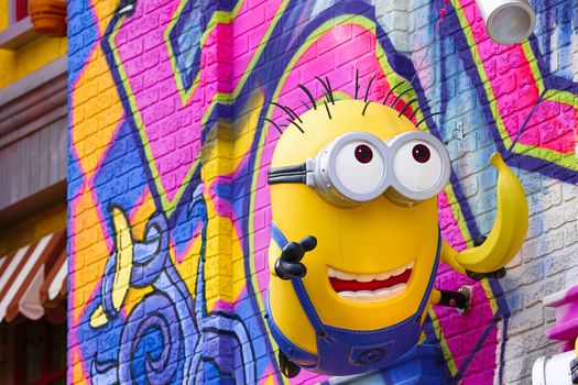 OSAKA, JAPAN - Feb 29, 2020 : Close up of HAPPY MINION statue, located in Universal Studios Japan. Minions are famous character from Despicable Me animation.