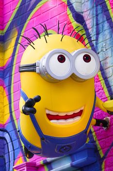 OSAKA, JAPAN - Feb 29, 2020 : Close up of HAPPY MINION statue, located in Universal Studios Japan. Minions are famous character from Despicable Me animation.