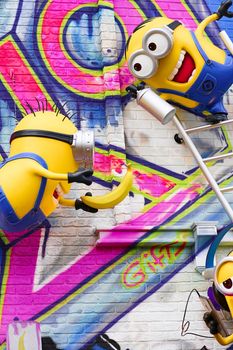 OSAKA, JAPAN - Feb 29, 2020 : Close up of HAPPY MINION statue, located in Universal Studios Japan. Minions are famous character from Despicable Me animation.