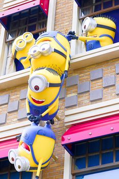 SAKA, JAPAN - June 24, 2017 : Statue of "HAPPY MINION", located in Universal Studios Japan, Osaka, Japan. Minions are famous character from Despicable Me animation.