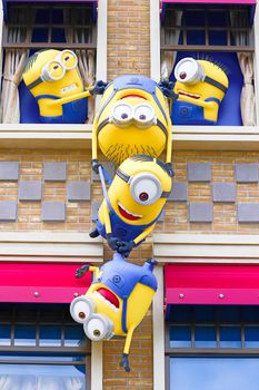 OSAKA, JAPAN - Nov 13, 2019 : Close up HAPPY MINION statue in Universal Studios Japan. Minions are famous character from Despicable Me animation.