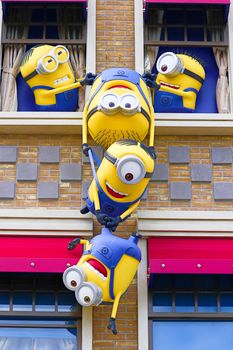 OSAKA, JAPAN - Nov 13, 2019 : Close up HAPPY MINION statue in Universal Studios Japan. Minions are famous character from Despicable Me animation.