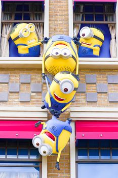 OSAKA, JAPAN - Nov 13, 2019 : Close up HAPPY MINION statue in Universal Studios Japan. Minions are famous character from Despicable Me animation.