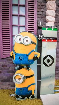 OSAKA, JAPAN - Nov 13, 2019 : Close up HAPPY MINION statue in Universal Studios Japan. Minions are famous character from Despicable Me animation.