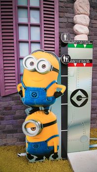 OSAKA, JAPAN - Nov 13, 2019 : Close up HAPPY MINION statue in Universal Studios Japan. Minions are famous character from Despicable Me animation.