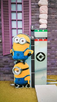 OSAKA, JAPAN - Nov 13, 2019 : Close up HAPPY MINION statue in Universal Studios Japan. Minions are famous character from Despicable Me animation.