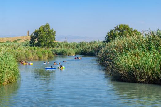 Nir David, Israel - August 23, 2020: View of Nahal HaKibutzim, with visitors, in the Spring Valley Park (Park Hamaayanot), Northern Israel