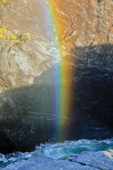 Beautiful waterfall Rjukandefossen with a colorful rainbow in Hemsedal, Buskerud, Norway.