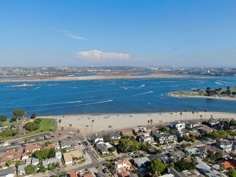 Aerial view of Mission Bay and beaches in San Diego, California. USA. Community built on a sandbar with villas and recreational Mission Bay Park. Californian beach-lifestyle.