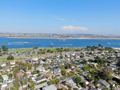 Aerial view of Mission Bay and beaches in San Diego, California. USA. Community built on a sandbar with villas and recreational Mission Bay Park. Californian beach-lifestyle.