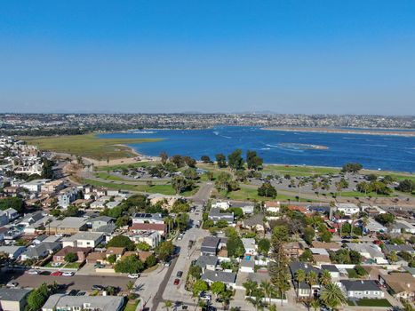 Aerial view of Mission Bay and beaches in San Diego, California. USA. Community built on a sandbar with villas and recreational Mission Bay Park. Californian beach-lifestyle.