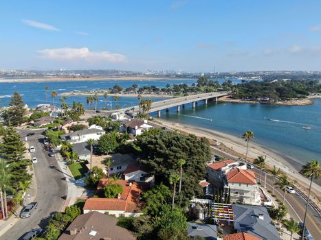 Aerial view of Mission Bay and beaches in San Diego, California. USA. Community built on a sandbar with villas and recreational Mission Bay Park. Californian beach-lifestyle.