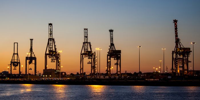 Cargo cranes in Melbourne's Docklands area on a summer's eveing in Melbourne, Victoria, Australia