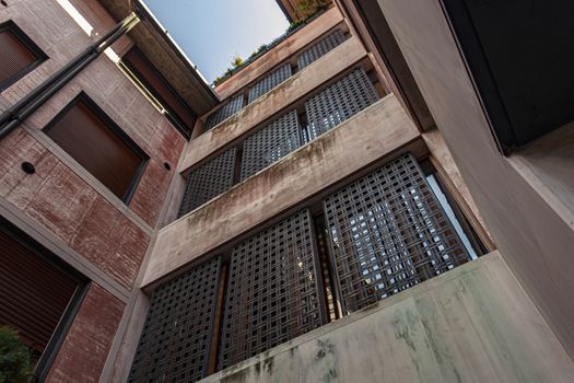 Concrete building detail in Treviso in Italy under a blue sky