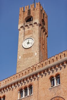 Clock tower or Torre Civica in Italian in Treviso in Italy in a sunny day