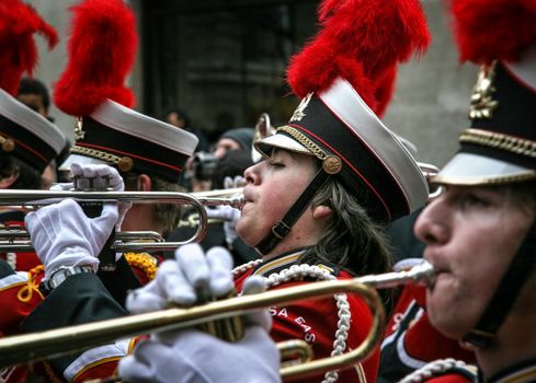 London, United Kingdom - January 01, 2007: Unknown member of Wauwatosa East high school marching band playing trumpet during their performance at London's New Year parade.