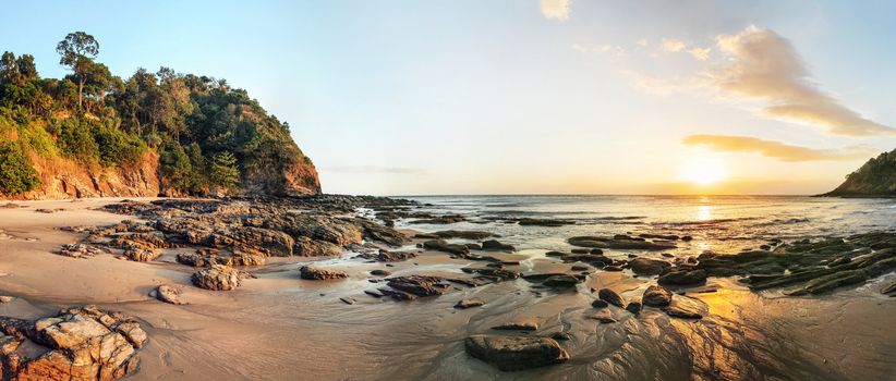 High resolution wide panorama of sunset on Koh Lanta beach during low tide.