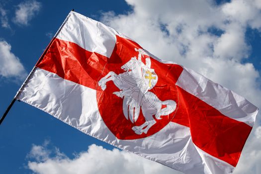 Flag with historical Belarus emblem. Coat of arms of Belarus.