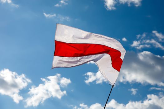White-red-white flag on blue sky background. Historical Belarus authentic flag.