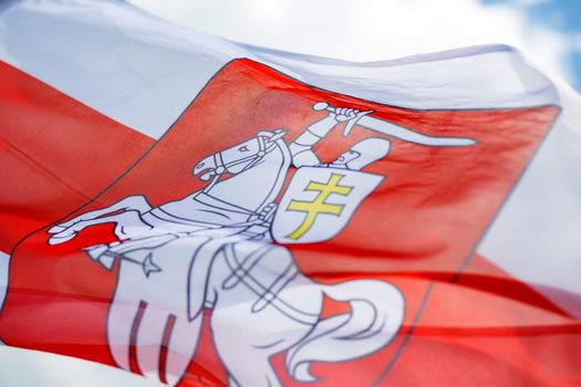 Flag with historical Belarus emblem. Coat of arms of Belarus.