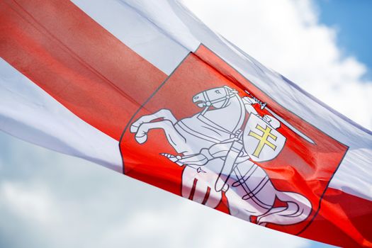 Flag with historical Belarus emblem. Coat of arms of Belarus.