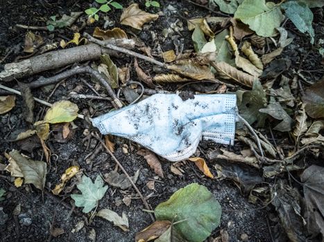 Dirty surgical masks in nature. Corona virus pollution. Leherheide, Bremerhaven.