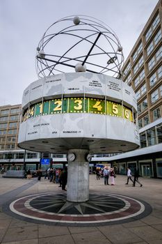 BERLIN, GERMANY - MARCH 24 2017: Famous World Clock located and Berlin Skyline in Alexanderplatz at March 24 2017 in Berlin, Germany