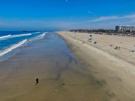 Aerial view of Huntington Beach and coastline during hot blue sunny summer day, Southeast of Los Angeles. California. destination for holiday and surfer