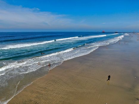 Aerial view of Huntington Beach and coastline during hot blue sunny summer day, Southeast of Los Angeles. California. destination for holiday and surfer