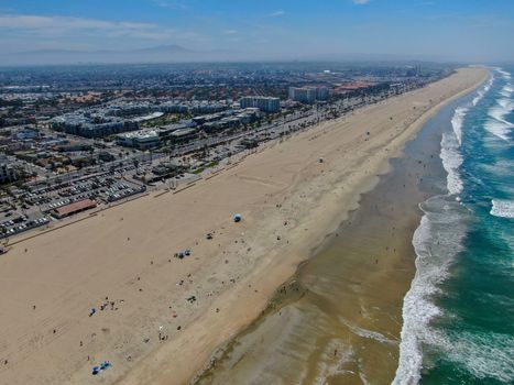 Aerial view of Huntington Beach and coastline during hot blue sunny summer day, Southeast of Los Angeles. California. destination for holiday and surfer