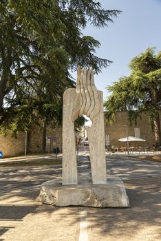 montefalco,italy august 13 2020:Monument outside the Rocca gate in Montefalco