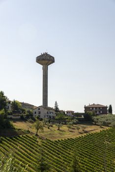 montefalco,italy august 13 2020:Tower outside Montefalco with weight dealers