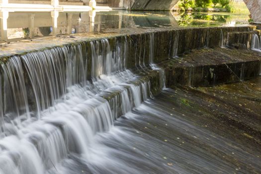 waterfalls outside the town of Bevagna on a sunny day
