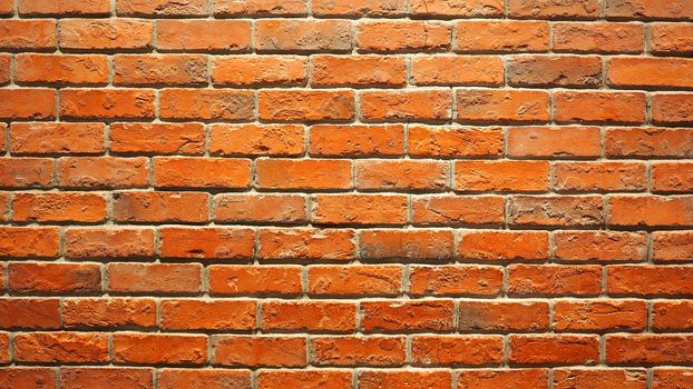 Red brick wall and old dirty rough surface texture close-up.