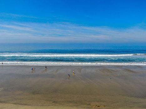 Aerial view of Huntington Beach and coastline during hot blue sunny summer day, Southeast of Los Angeles. California. destination for holiday and surfer