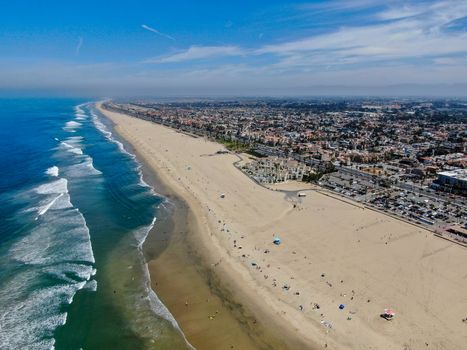 Aerial view of Huntington Beach and coastline during hot blue sunny summer day, Southeast of Los Angeles. California. destination for holiday and surfer